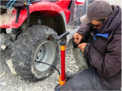 Josh's skills have proven invaluable, as he has been called on to repair our ATVs multiple times. Here, he fixes a slice in an ATV’s tire from a sharp rock.