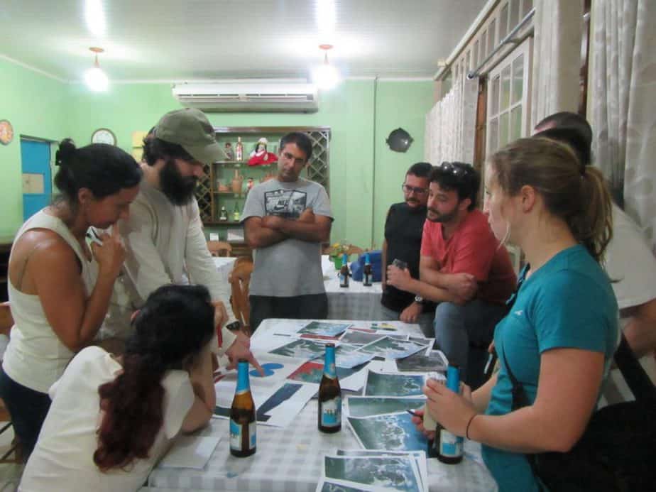 Our team chooses areas for the next days surveys. Beer is essential!